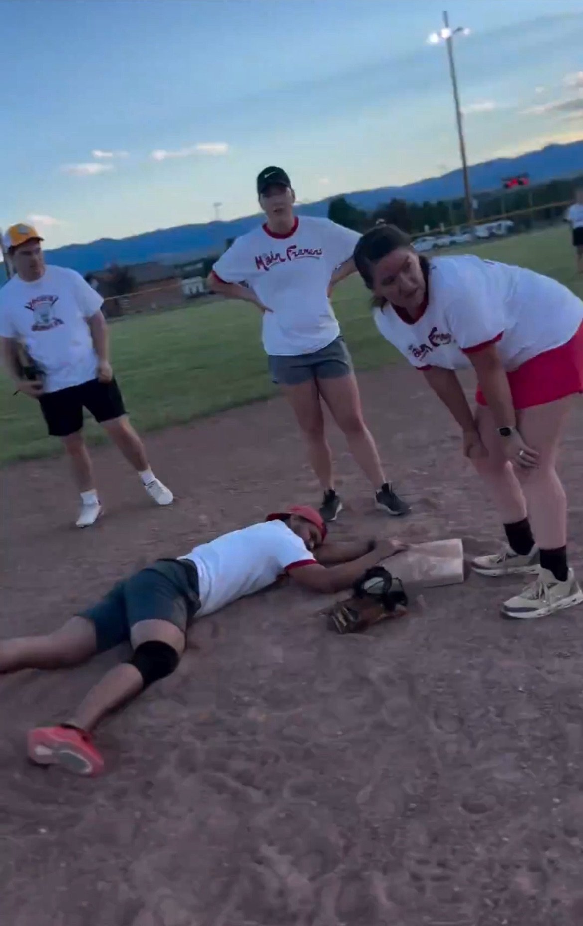 A boy breaks his fingers sliding into base because he is not using Incredible Instincts sliding mitt.